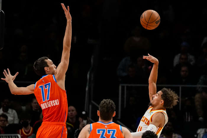 Atlanta Hawks guard Trae Young (11) shoots over Oklahoma City Thunder forward Aleksej Pokusevski (17) during the first half at State Farm Arena.